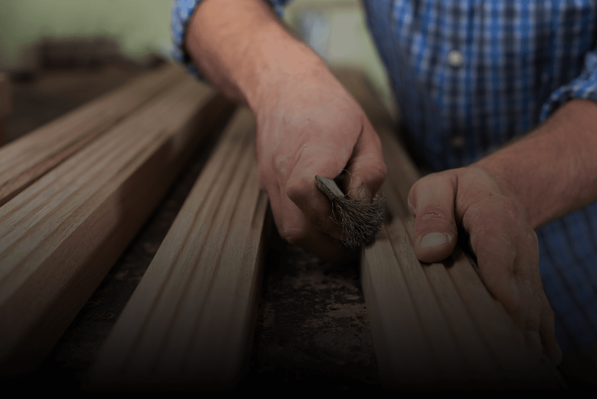 Carpenter smoothing timber surface